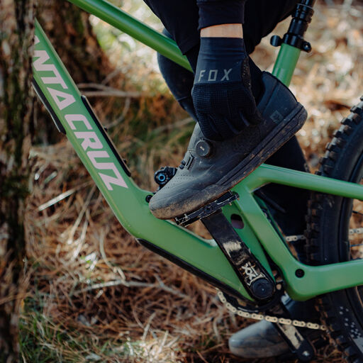Person sitting on this bike and adjusting a Boa dial.